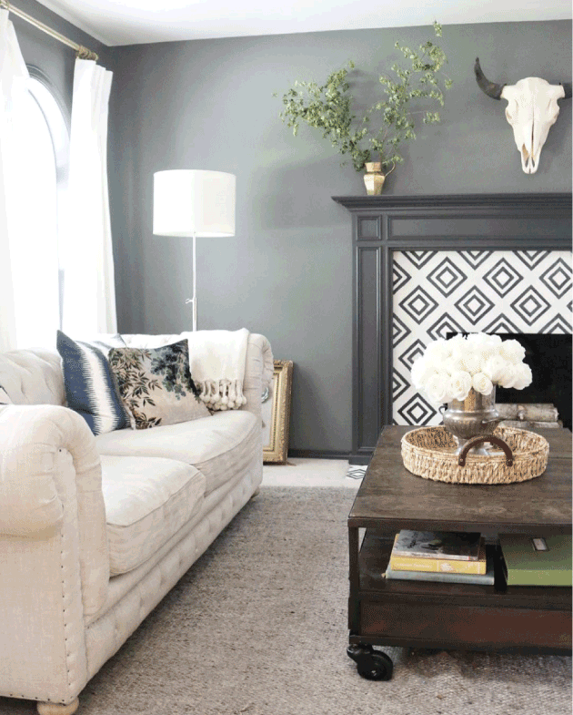 linen sofa graphic tile fireplace