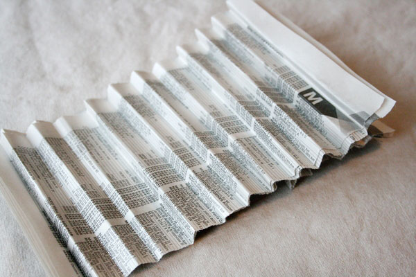 fold-stack-of-paper-into-pleats